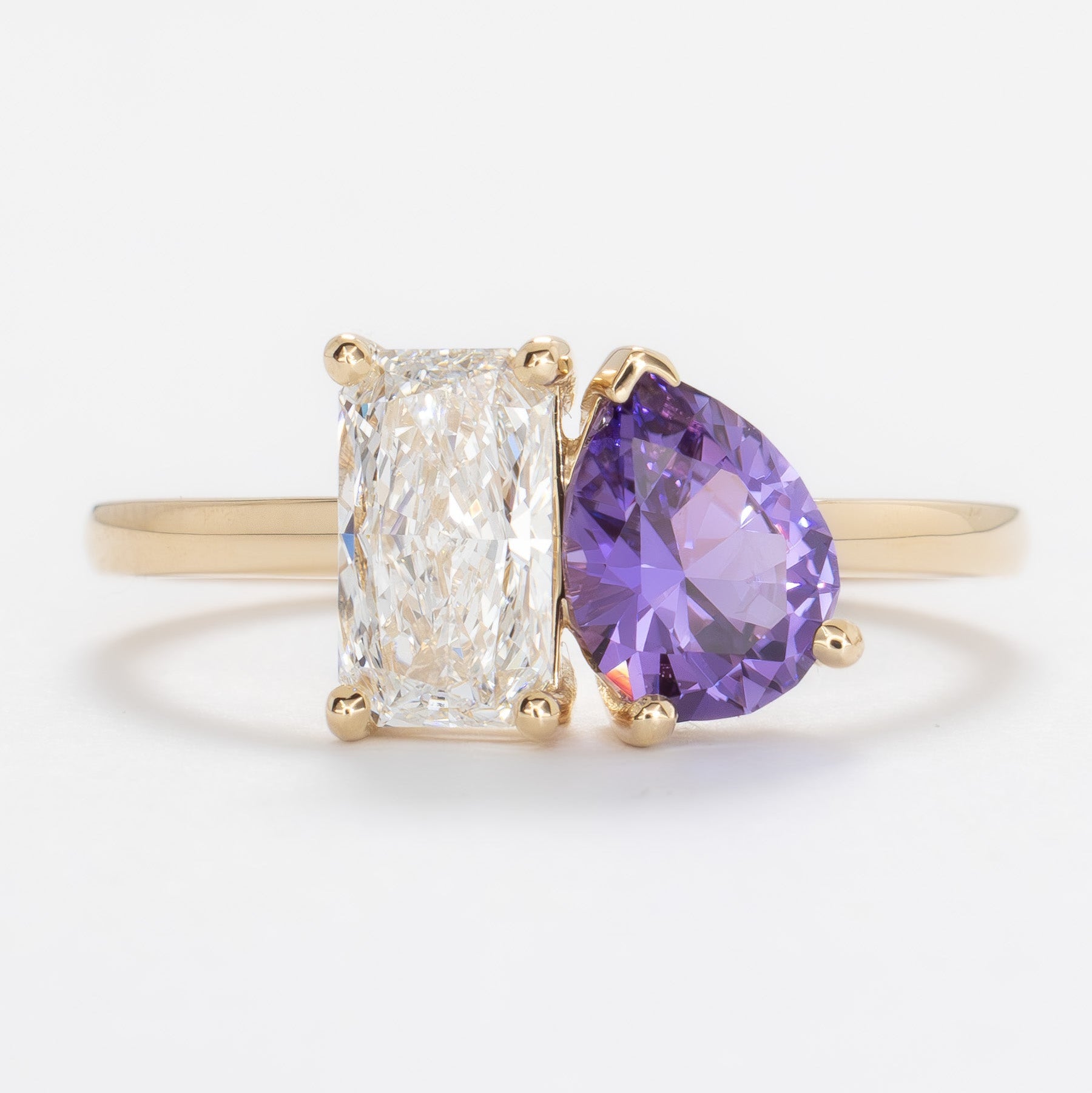 toi et moi ring with lab diamond radiant and purple lab sapphire pear