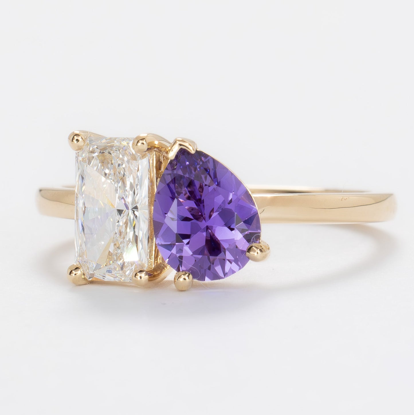 toi et moi ring with lab diamond radiant and purple lab sapphire pear