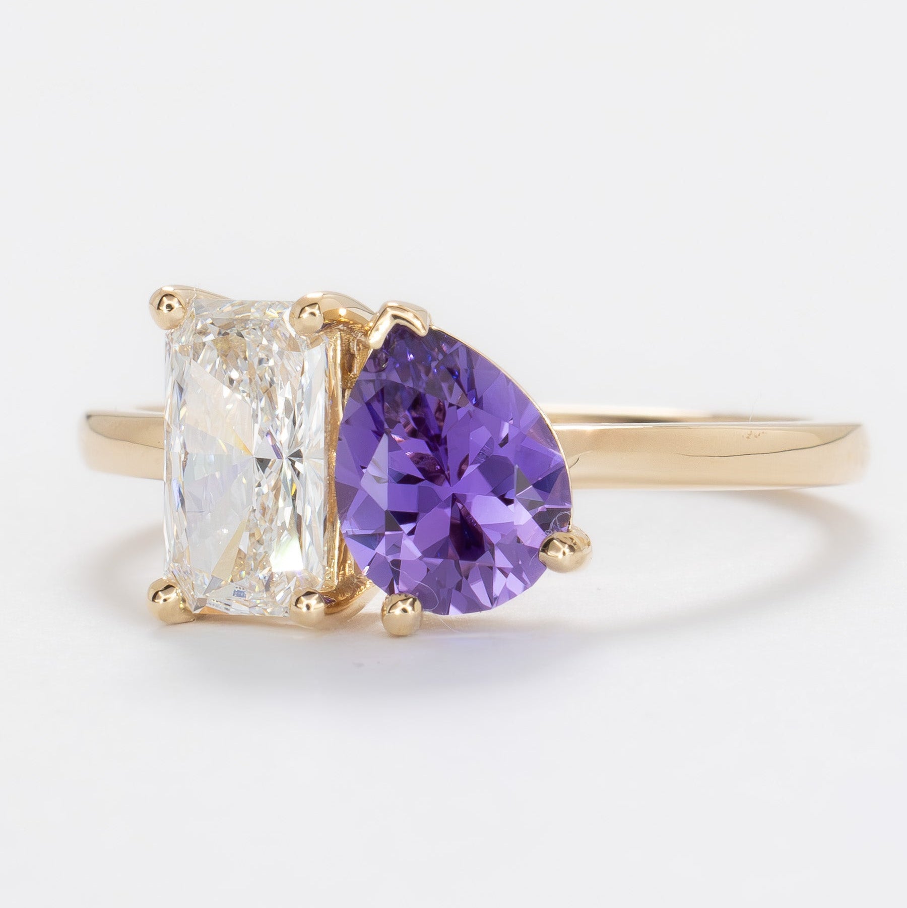 toi et moi ring with lab diamond radiant and purple lab sapphire pear