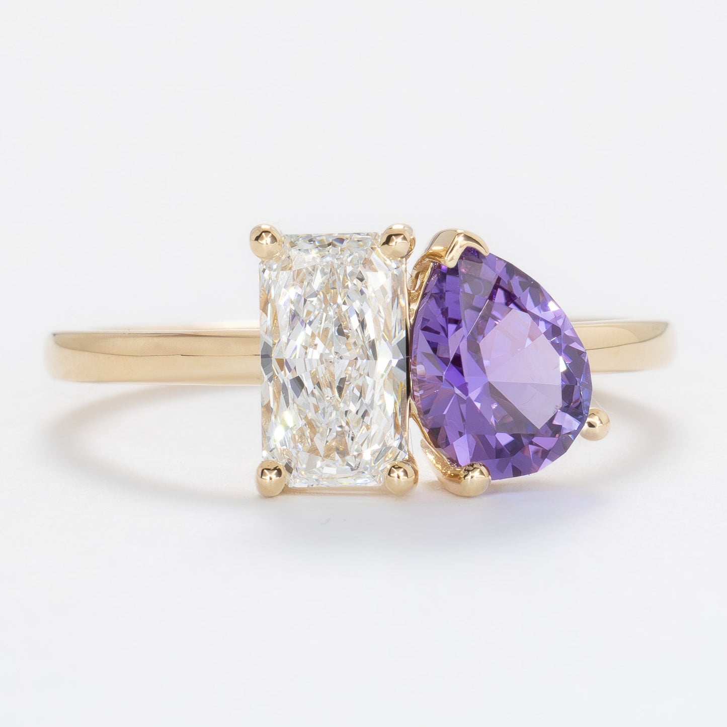 toi et moi ring with lab diamond radiant and purple lab sapphire pear