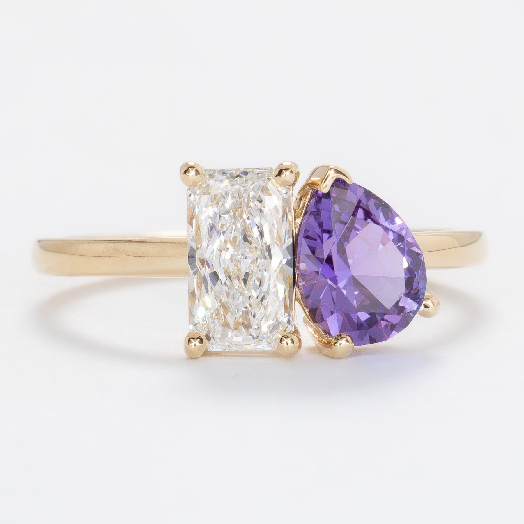 toi et moi ring with lab diamond radiant and purple lab sapphire pear