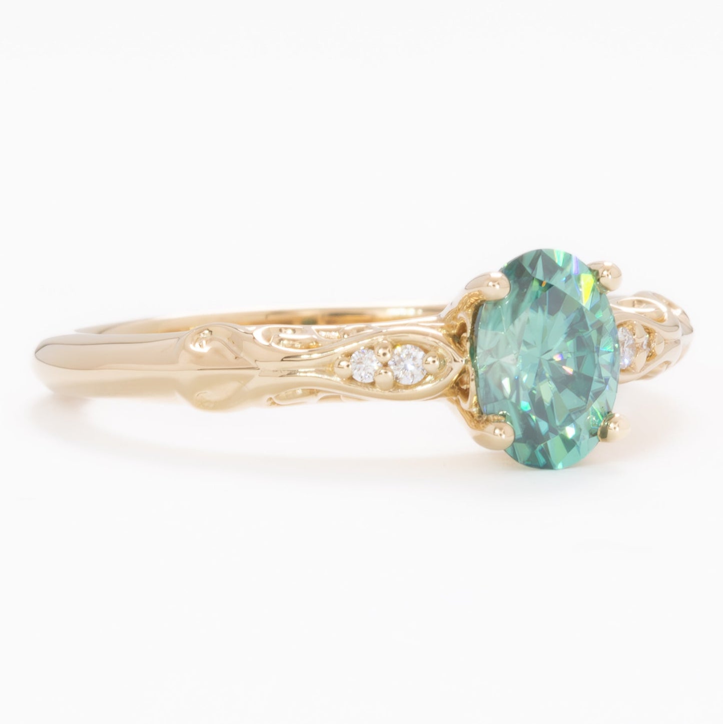 victoria engagement ring with oval green moissanite