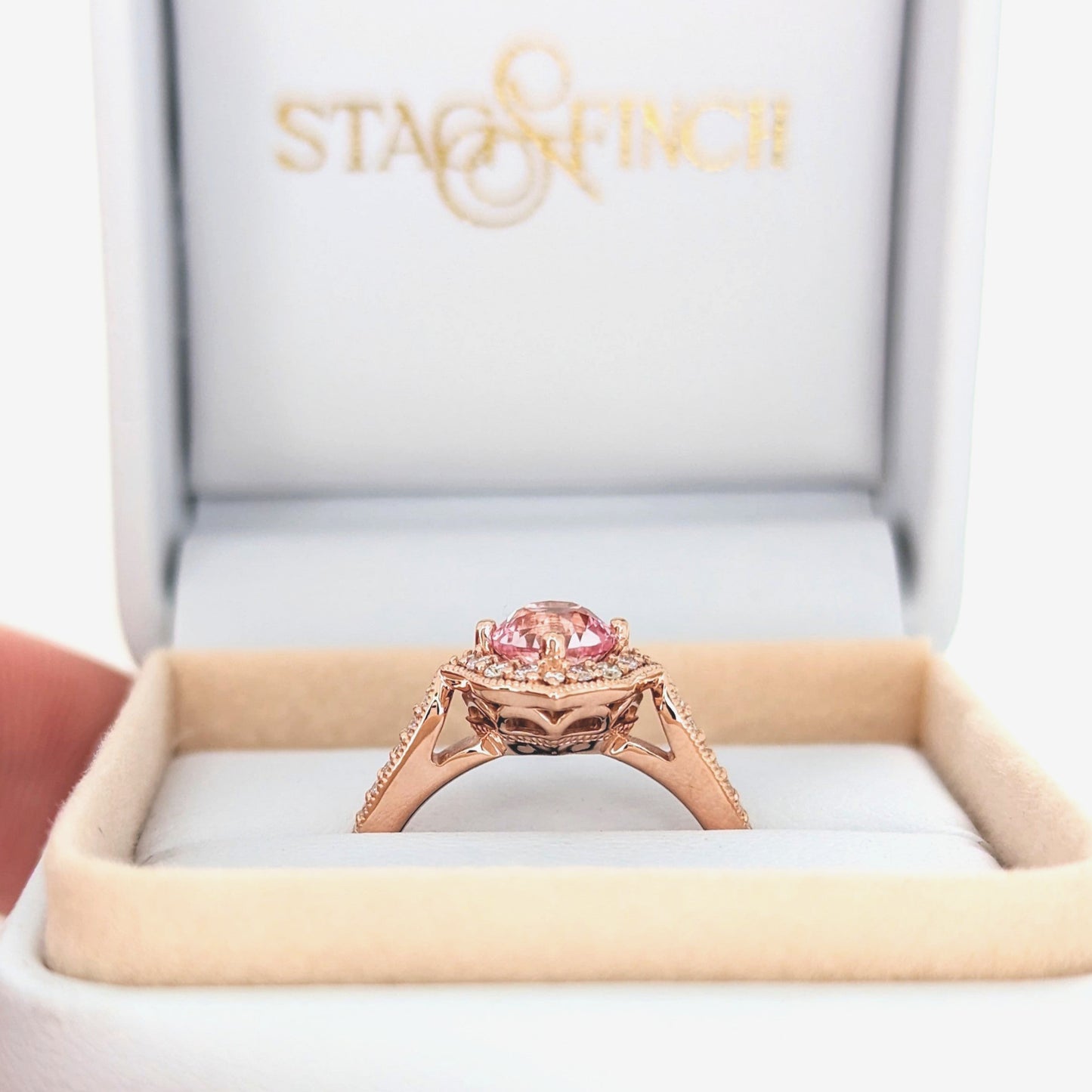 violet engagement ring with peach lab sapphire round in rose gold