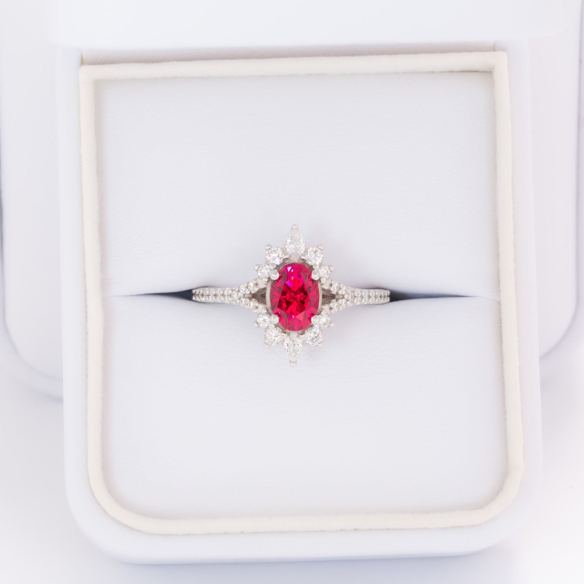 white gold luna engagement ring with oval lab ruby