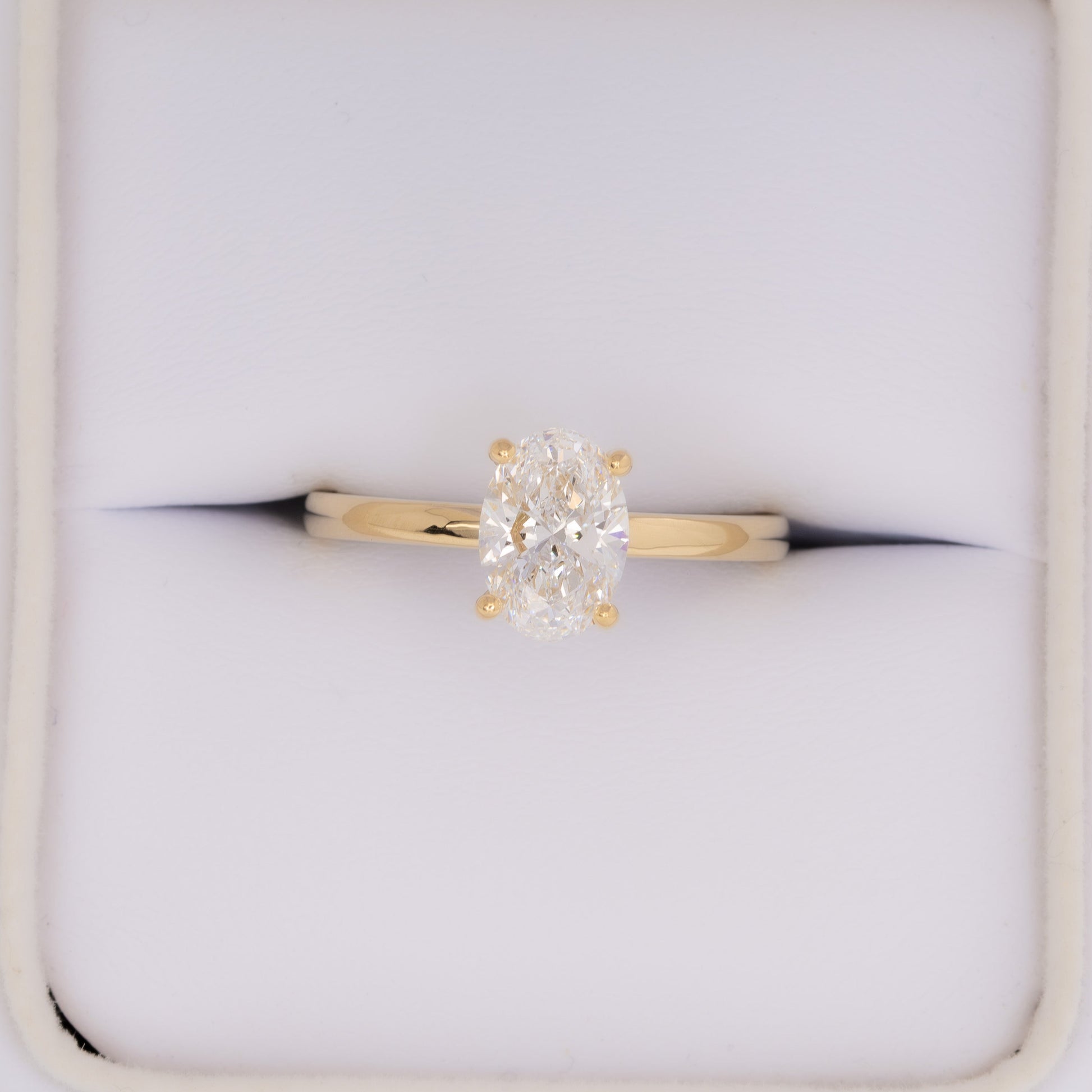 yellow gold serene solitaire with oval lab diamond