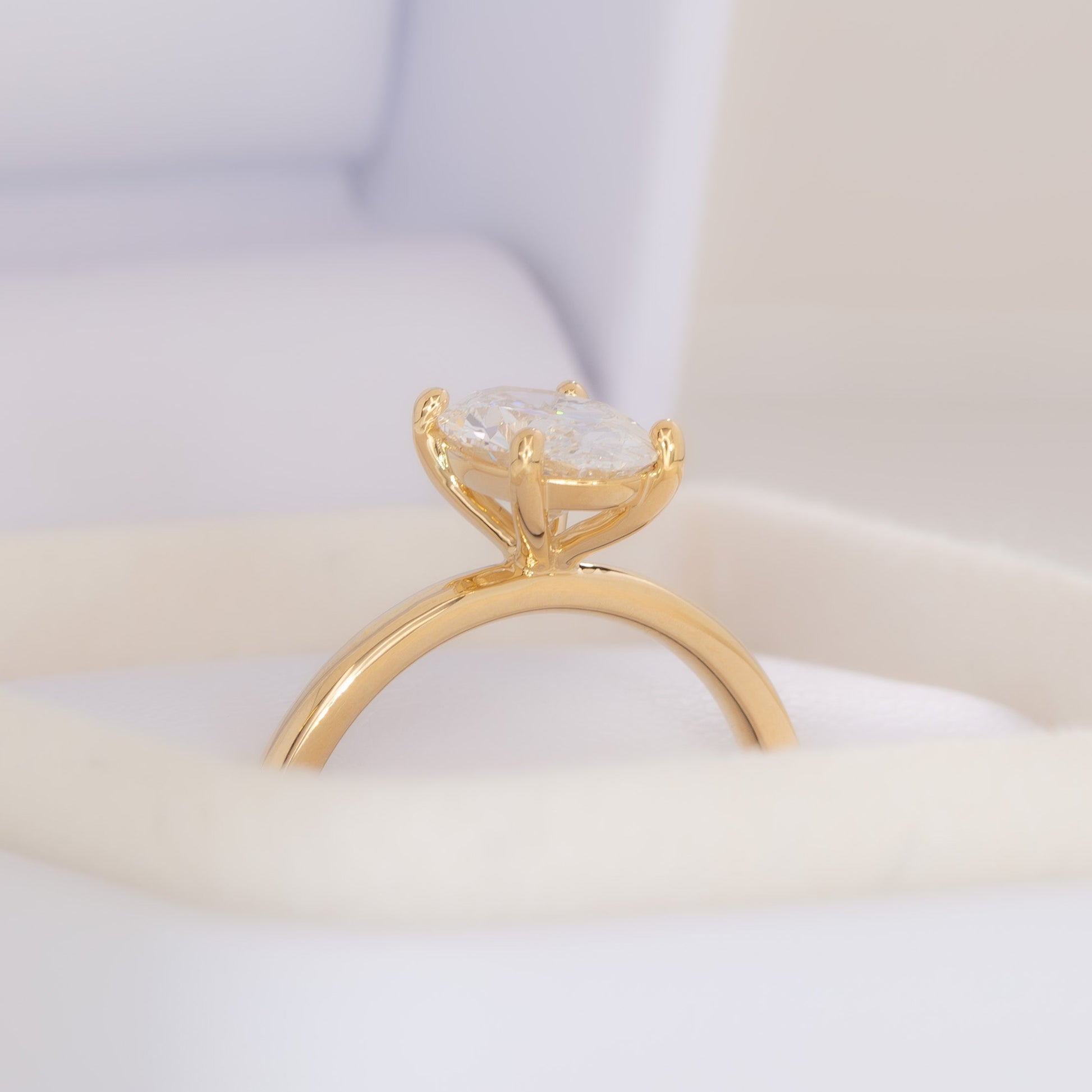yellow gold serene solitaire with oval lab diamond