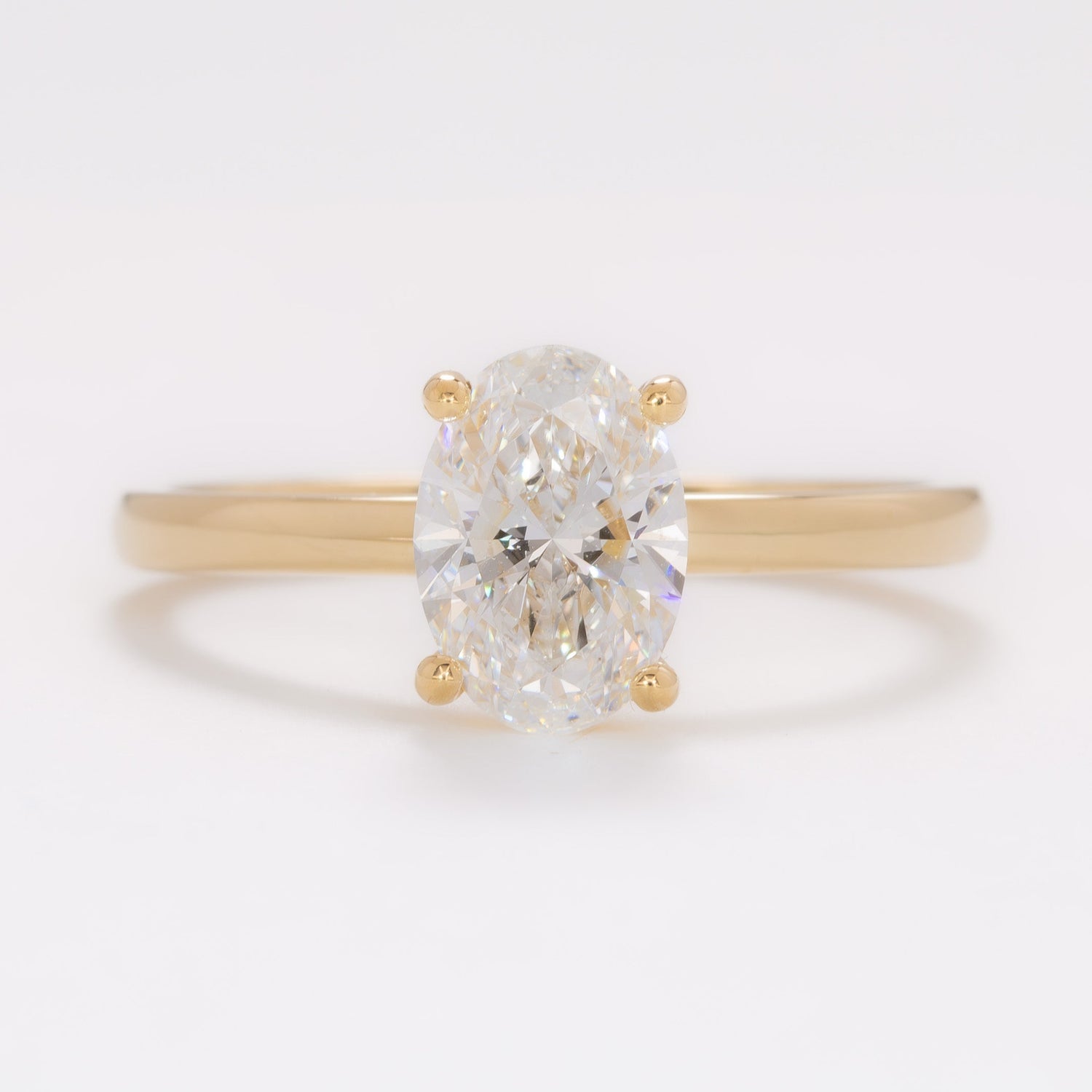 yellow gold serene solitaire with oval lab diamond
