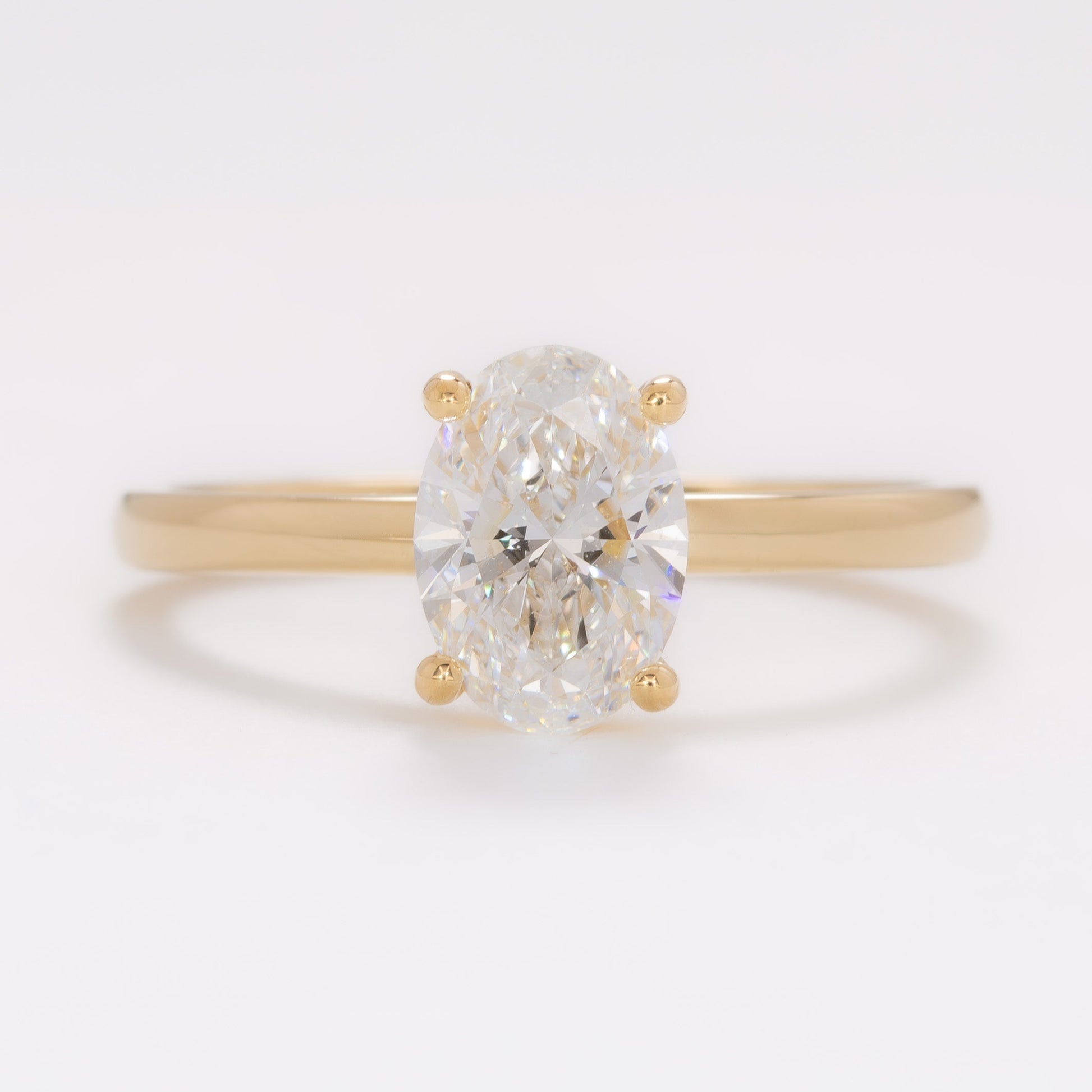 yellow gold serene solitaire with oval lab diamond