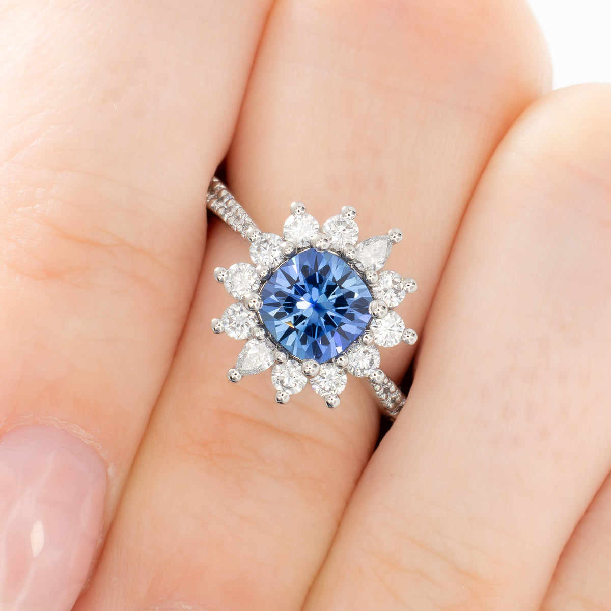 zena halo ring in platinum with cushion periwinkle lab sapphire