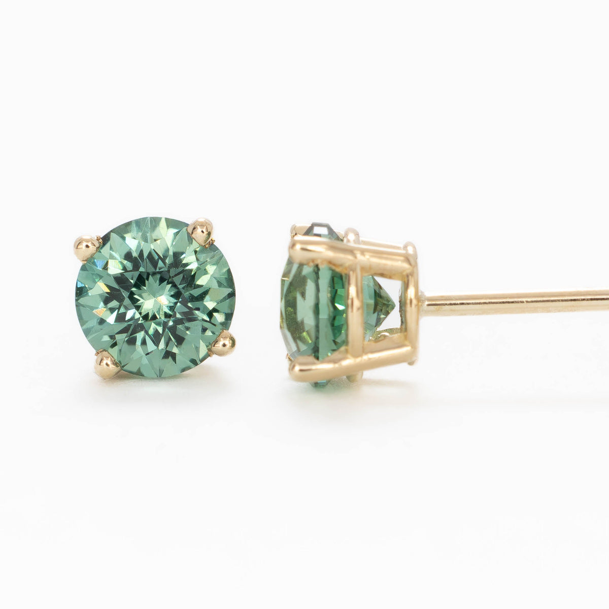 zoe earrings in yellow gold with green lab sapphire rounds