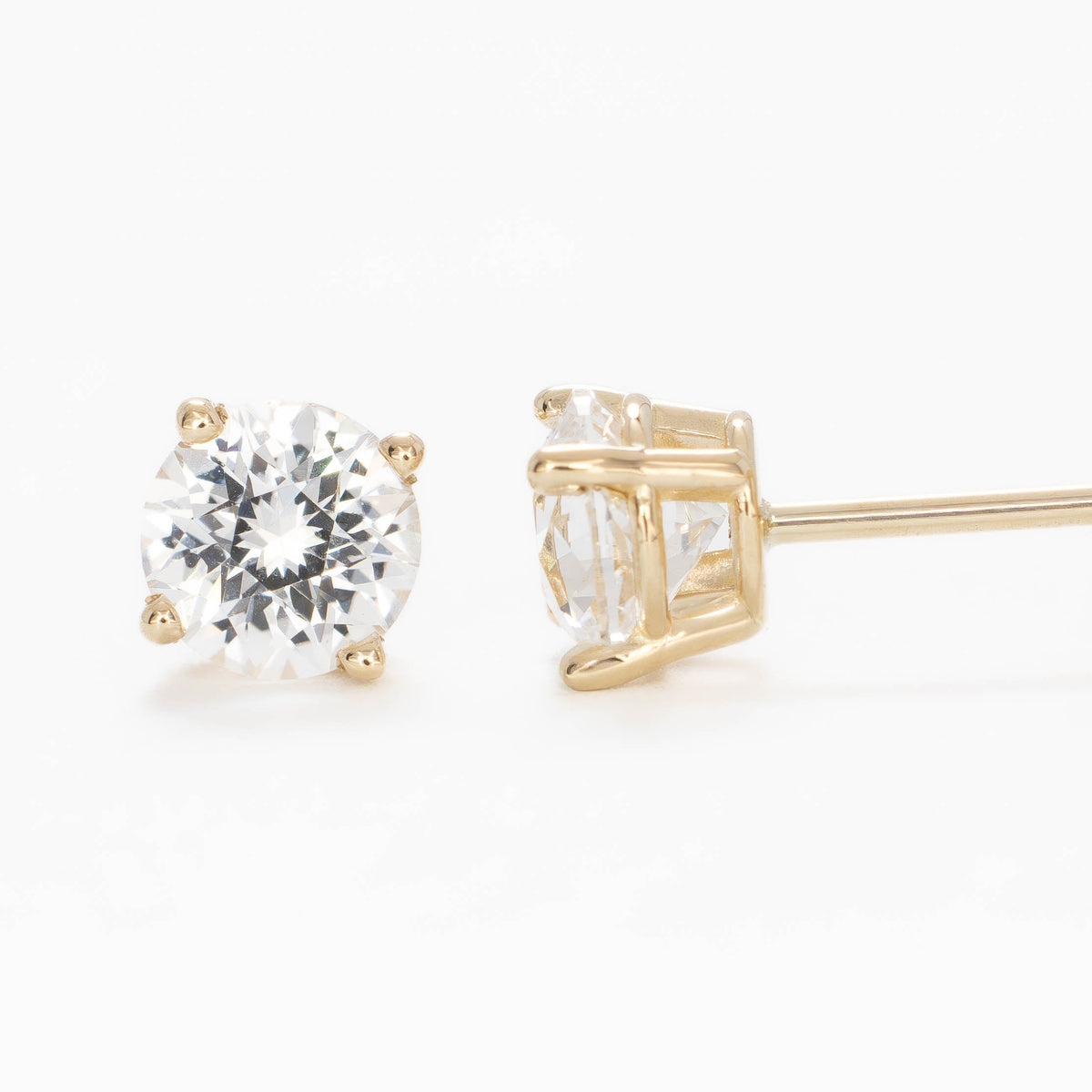 zoe earrings in yellow gold with white lab sapphire rounds