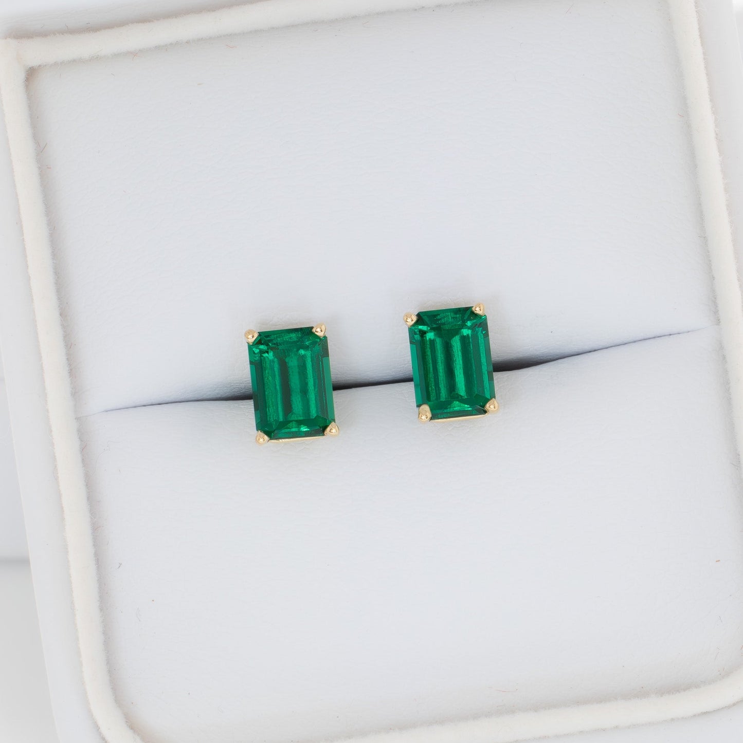 zoe earrings with lab emerald step cut
