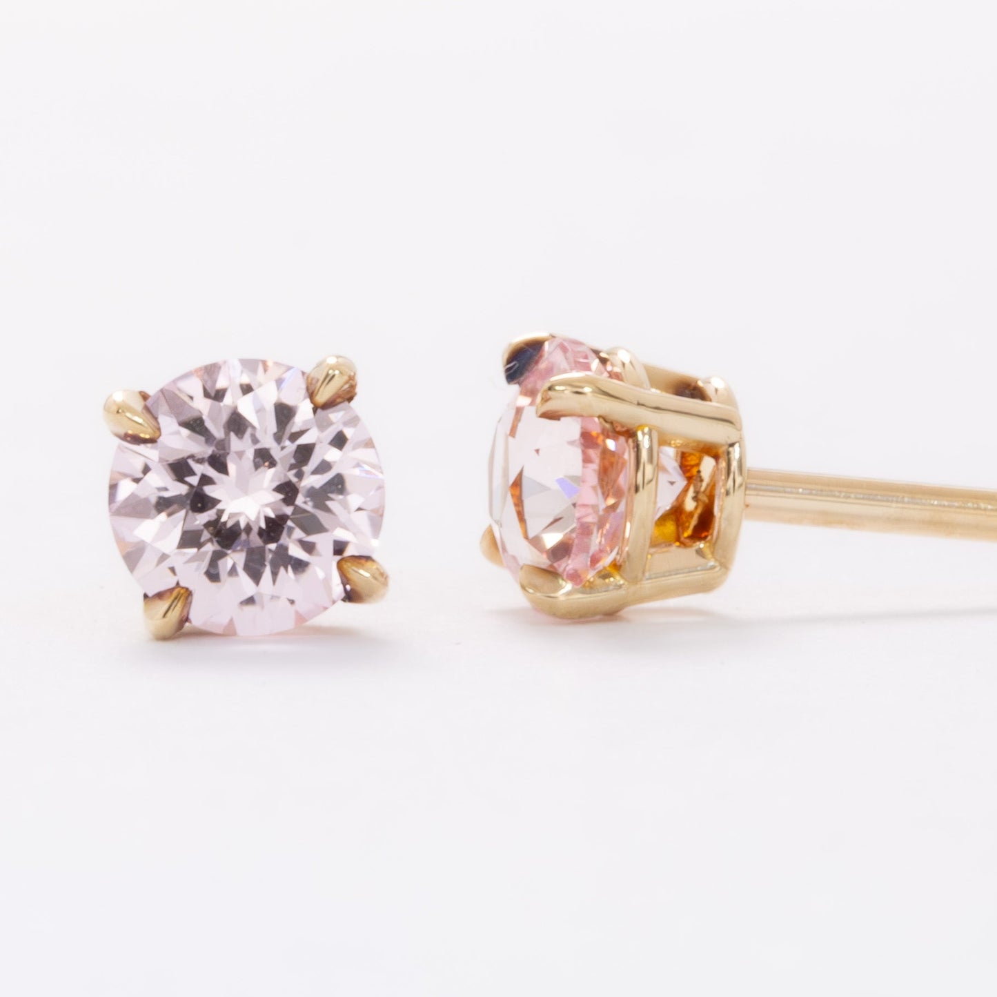 zoe earrings with peach round lab sapphires