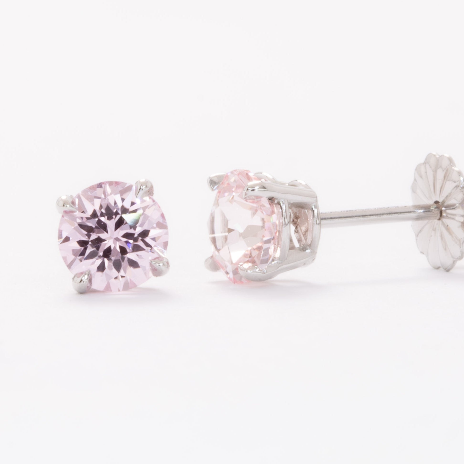 zoe earrings with peach round lab sapphires